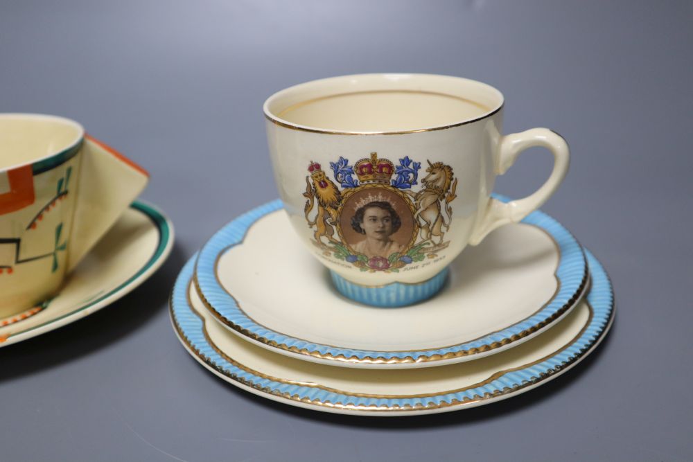 A Clarice Cliff Ravel pattern tea cup and saucer and a Queen Elizabeth II coronation trio, 1953
